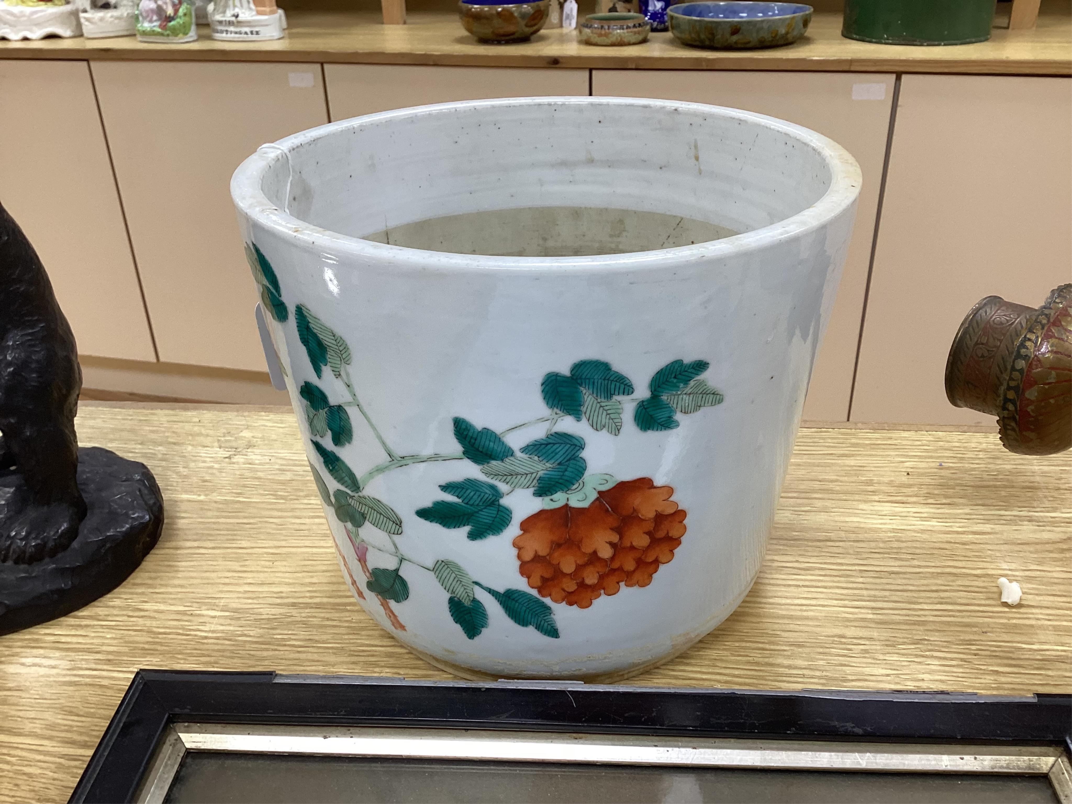 A 19th century Chinese famille rose flower pot, 19.5cm high. Condition - hole drilled to base.